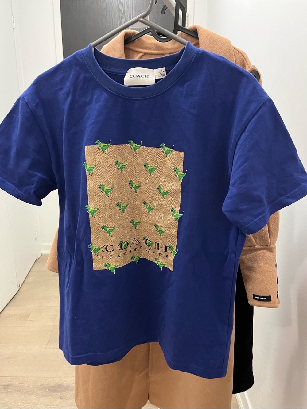 Coach Royal Blue T-shirt with Tan Logo Panel and Green Dino Print
